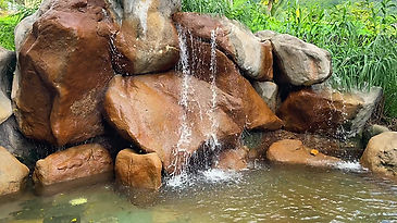 Man-made fountain with natural rocks